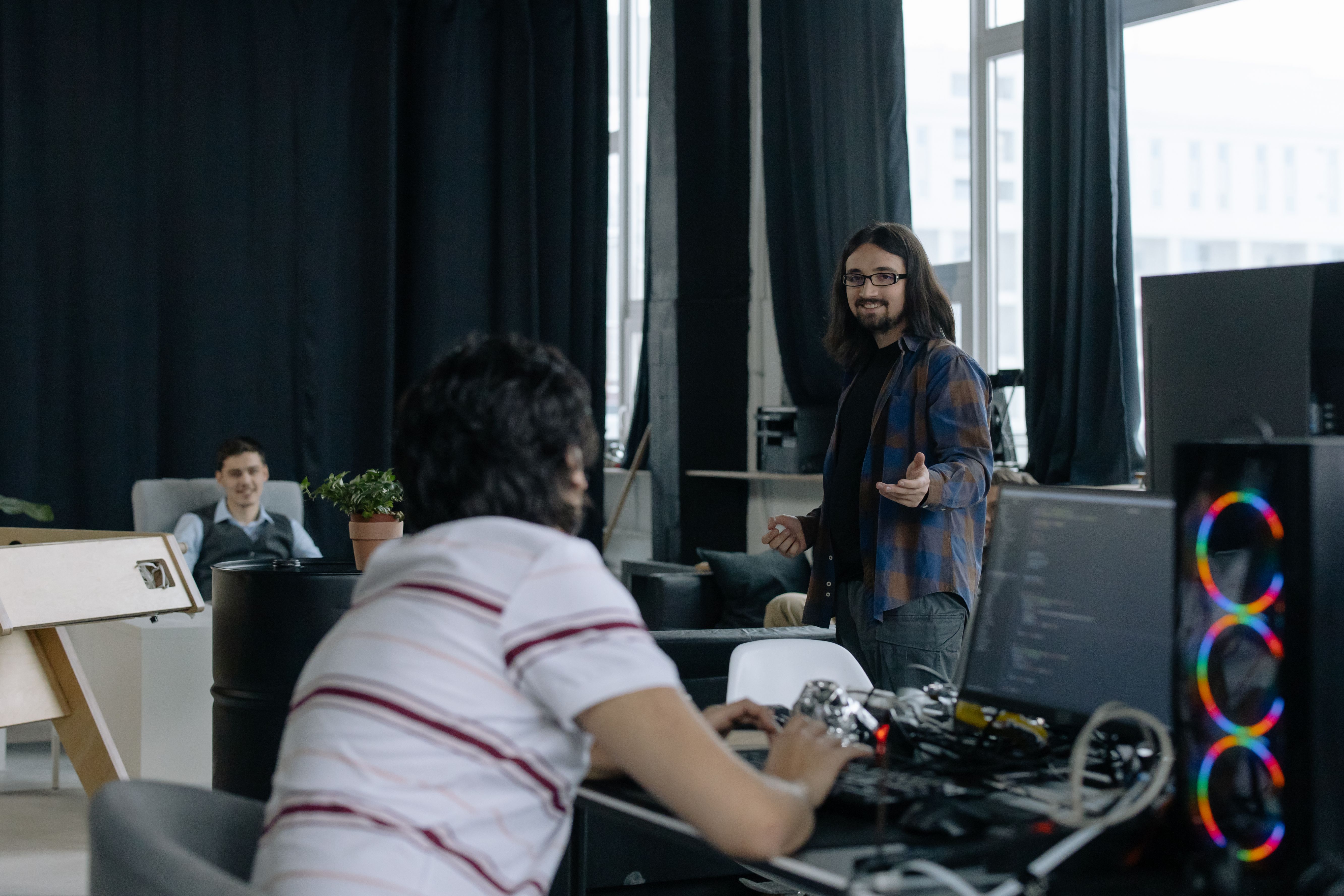 SID team reviewing a real, running product on screen at the HCMC studio